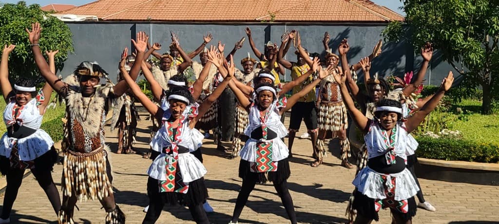 Female dancers with woven baskets at a school workshop